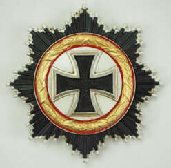 1957: Deutsches Kreuz, in Gold.