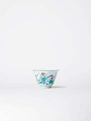 A FINE AND SUPERBLY DECORATED DOUCAI ‘LOTUS POND’ WINE CUP