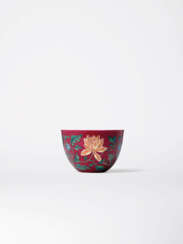 AN EXQUISITE IMPERIAL RUBY RED-GROUND FALANGCAI ‘INDIAN LOTUS’ WINE CUP