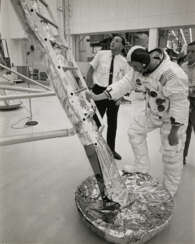 NEIL ARMSTRONG DESCENDS LADDER OF LUNAR MODULE TRAINING SPACECRAFT, JULY 10, 1969