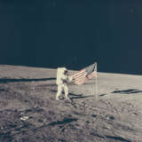 PETE CONRAD HOLDING THE U.S. FLAG ON THE OCEAN OF STORMS, NOVEMBER 14-24, 1969 - photo 1