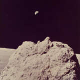 THE MAJESTIC EARTH ABOVE A LARGE LUNAR BOULDER, STATION 2, DECEMBER 7-19, 1972, EVA 2 - фото 1