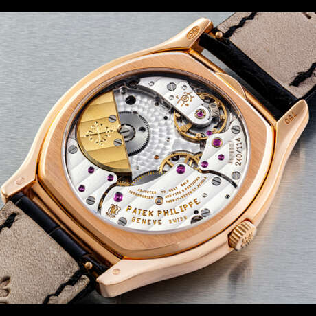 PATEK PHILIPPE. AN 18K PINK GOLD TONNEAU-SHAPED AUTOMATIC PERPETUAL CALENDAR WRISTWATCH WITH MOON PHASES, 24 HOUR AND LEAP YEAR INDICATION - photo 2