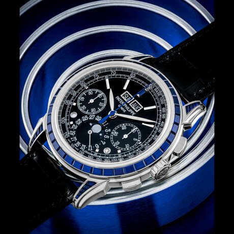 PATEK PHILIPPE. AN IMPRESSIVE AND VERY RARE PLATINUM AND SAPPHIRE-SET PERPETUAL CALENDAR CHRONOGRAPH WRISTWATCH WITH MOON PHASES, LEAP YEAR AND DAY/NIGHT INDICATION - photo 1