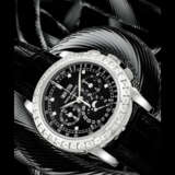 PATEK PHILIPPE. A RARE PLATINUM AND BAGUETTE-CUT DIAMOND-SET PERPETUAL CALENDAR CHRONOGRAPH WRISTWATCH WITH MOON PHASES, 24 HOUR AND LEAP YEAR INDICATION - photo 1