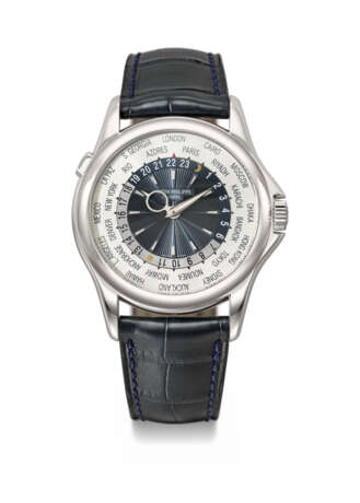 PATEK PHILIPPE. AN ATTRACTIVE PLATINUM AUTOMATIC WORLD TIME WRISTWATCH WITH CERTIFICATE OF ORIGIN AND BOX - photo 1