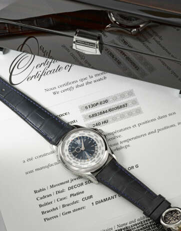 PATEK PHILIPPE. AN ATTRACTIVE PLATINUM AUTOMATIC WORLD TIME WRISTWATCH WITH CERTIFICATE OF ORIGIN AND BOX - photo 2