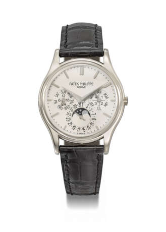 PATEK PHILIPPE. A 18K WHITE GOLD AUTOMATIC PERPETUAL CALENDAR WRISTWATCH WITH MOON PHASES, 24 HOUR, LEAP YEAR INDICATION, ADDITIONAL CASE BACK, CERTIFICATE OF ORIGIN AND BOX - photo 1