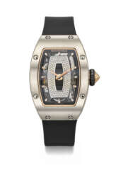 RICHARD MILLE. A LADY&#39;S RARE AND ATTRACTIVE 18K WHITE GOLD AND DIAMOND-SET TONNEAU-SHAPED AUTOMATIC SEMI-SKELETONIZED WRISTWATCH WITH ONYX DIAL