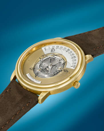 AUDEMARS PIGUET. AN ATTRACTIVE AND UNUSUAL 18K GOLD AUTOMATIC WANDERING HOUR WRISTWATCH - Foto 2