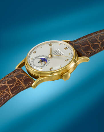 PATEK PHILIPPE. A RARE AND ATTRACTIVE 18K GOLD PERPETUAL CALENDAR WRISTWATCH WITH MOON PHASES - photo 2