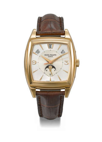PATEK PHILIPPE. AN ELEGANT 18K PINK GOLD TONNEAU-SHAPED AUTOMATIC ANNUAL CALENDAR WRISTWATCH WITH SWEEP CENTRE SECONDS, MOON PHASES, 24-HOUR INDICATION, CERTIFICATE OF ORIGIN AND BOX - фото 1