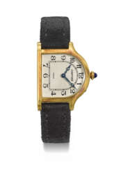 CARTIER. A VERY RARE AND UNUSUAL 18K GOLD LIMITED EDITION BELL-SHAPED WRISTWATCH