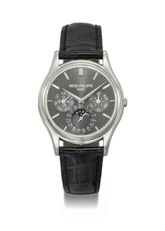 PATEK PHILIPPE. AN ATTRACTIVE PLATINUM AUTOMATIC PERPETUAL CALENDAR WRISTWATCH WITH MOON PHASES, 24 HOUR AND LEAP YEAR INDICATION, ADDITIONAL CASE BACK, CERTIFICATE OF ORIGIN AND BOX - photo 1