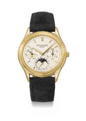 PATEK PHILIPPE. AN ELEGANT 18K GOLD AUTOMATIC PERPETUAL CALENDAR WRISTWATCH WITH MOON PHASES, 24 HOUR AND LEAP YEAR INDICATION, CERTIFICATE OF ORIGIN AND BOX