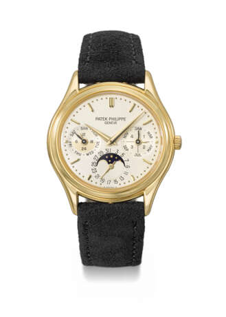 PATEK PHILIPPE. AN ELEGANT 18K GOLD AUTOMATIC PERPETUAL CALENDAR WRISTWATCH WITH MOON PHASES, 24 HOUR AND LEAP YEAR INDICATION, CERTIFICATE OF ORIGIN AND BOX - photo 1