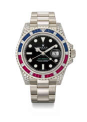 ROLEX. A RARE AND ATTRACTIVE 18K WHITE GOLD, DIAMOND, RUBY AND SAPPHIRE-SET AUTOMATIC DUAL TIME WRISTWATCH WITH SWEEP CENTRE SECONDS, DATE, BRACELET, GUARANTEE AND BOX