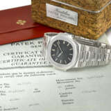 PATEK PHILIPPE. A VERY RARE STAINLESS STEEL AUTOMATIC WRISTWATCH WITH DATE, BRACELET, CORK BOX AND CERTIFICATE OF GUARANTEE - фото 2