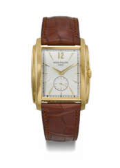 PATEK PHILIPPE. AN ATTRACTIVE 18K GOLD TONNEAU-SHAPED WRISTWATCH WITH CERTIFICATE OF ORIGIN AND BOX