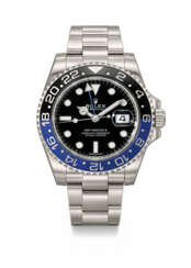 ROLEX. A STAINLESS STEEL AUTOMATIC DUAL TIME WRISTWATCH WITH SWEEP CENTRE SECONDS, DATE, BRACELET, GUARANTEE AND BOX