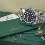 ROLEX. A STAINLESS STEEL AUTOMATIC DUAL TIME WRISTWATCH WITH SWEEP CENTRE SECONDS, DATE, BRACELET, GUARANTEE AND BOX - фото 2