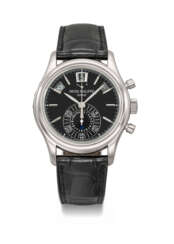 PATEK PHILIPPE. AN ATTRACTIVE PLATINUM AUTOMATIC ANNUAL CALENDAR FLYBACK CHRONOGRAPH WRISTWATCH WITH POWER RESERVE, DAY/NIGHT INDICATOR, CERTIFICATE OF ORIGIN AND BOX