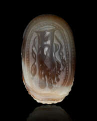 AN ETRUSCAN BANDED AGATE SCARAB WITH A FOOT RHYTON