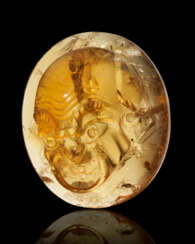 A ROMAN CITRINE CAMEO WITH A THEATER MASK