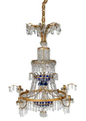 A NORTH EUROPEAN CUT-GLASS MOUNTED ORMOLU, BLUE GLASS AND ROCK CRYSTAL FOUR-LIGHT CHANDELIER