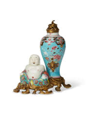 AN ORMOLU-MOUNTED CHINESE EXPORT PORCELAIN FAMILLE ROSE BUDDHA AND VASE GROUP