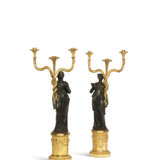 A PAIR OF CONSULAT ORMOLU AND PATINATED BRONZE THREE-LIGHT CANDELABRA - фото 1