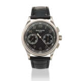 PATEK PHILIPPE. AN 18K WHITE GOLD CHRONOGRAPH WRISTWATCH WITH BLACK DIAL AND BREGUET NUMERALS - фото 1