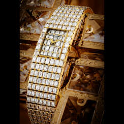 VACHERON CONSTANTIN. AN IMPRESSIVE 18K GOLD AND BAGUETTE-CUT DIAMOND-SET BRACELET WATCH