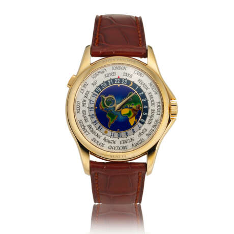PATEK PHILIPPE. AN 18K GOLD AUTOMATIC WORLD TIME WRISTWATCH WITH CLOISONN&#201; ENAMEL DIAL - photo 1