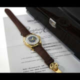 PATEK PHILIPPE. AN 18K GOLD AUTOMATIC WORLD TIME WRISTWATCH WITH CLOISONN&#201; ENAMEL DIAL - photo 4