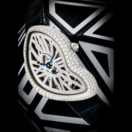 CARTIER. A PLATINUM AND DIAMOND-SET LIMITED EDITION SKELETONISED ASYMMETRICAL WRISTWATCH - фото 1