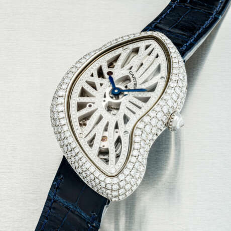 CARTIER. A PLATINUM AND DIAMOND-SET LIMITED EDITION SKELETONISED ASYMMETRICAL WRISTWATCH - Foto 2