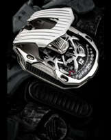 URWERK. A STAINLESS STEEL AND TITANIUM LIMITED EDITION SHIELD-SHAPED AUTOMATIC WRISTWATCH WITH WANDERING HOUR DISPLAY, DIGITAL SECONDS, AND POWER RESERVE INDICATION