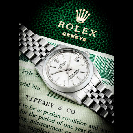 ROLEX. A RARE STAINLESS STEEL AUTOMATIC WRISTWATCH WITH SWEEP CENTRE SECONDS, DATE AND BRACELET - Foto 1