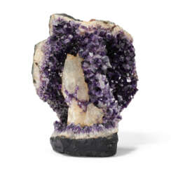 AN AMETHYST SEMI-GEODE WITH CALCITE INCLUSIONS
