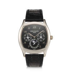 PATEK PHILIPPE, REF. 5940G-010, A FINE 18K WHITE GOLD TONNEAU SHAPED PERPETUAL CALENDAR WRISTWATCH WITH LEAP YEAR INDICATOR AND MOON PHASES