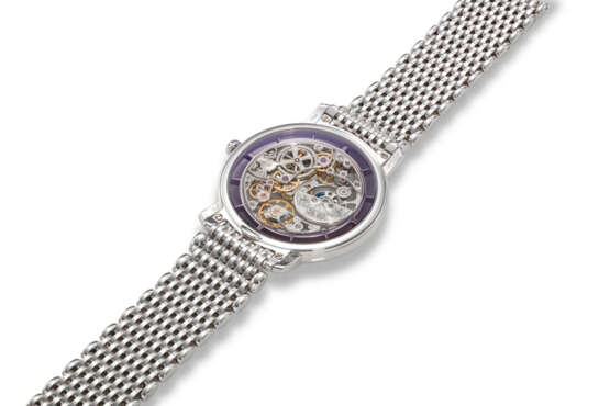 PATEK PHILIPPE, REF. 5180/1G-010, A FINE AND RARE 18K WHITE GOLD SKELETONISED WRISTWATCH ON BRACELET, RETAILED BY TIFFANY & CO. - photo 3