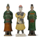 A YELLOW-GLAZED POTTERY FIGURE AND TWO GREEN AND AMBER-GLAZED POTTERY FIGURES OF ATTENDANTS - photo 1