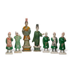 A GROUP OF SEVEN GREEN AND AMBER GLAZED POTTERY FIGURES