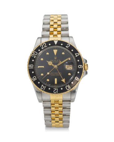 ROLEX, REF. 16753, GMT MASTER, AN 18K YELLOW GOLD AND STEEL DUAL TIME WRISTWATCH WITH DATE - Foto 1