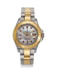 ROLEX, REF. 69623, YACHT-MASTER, A STEEL AND 18K YELLOW GOLD LADY’S WRISTWATCH WITH MOTHER-OF-PEARL DIAL AND DATE 