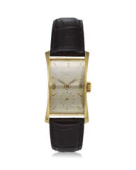 PATEK PHILIPPE, REF. 1593, “HOUR GLASS” AN 18K YELLOW GOLD RECTANGULAR SHAPED WRISTWATCH WITH SUBSIDIARY SECONDS 