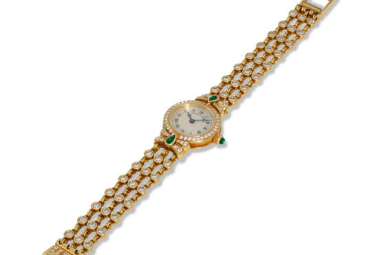 BREGUET, REF. 8611, A FINE LADY’S 18K YELLOW GOLD WRISTWATCH WITH DIAMOND AND EMERALD SETTING - Foto 2