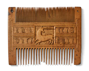 A CARVED BOXWOOD COMB WITH A UNICORN AND A ROOSTER