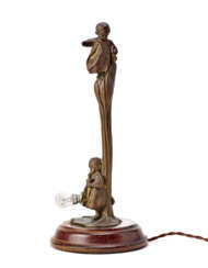 Patinated bronze Art Nouveau table lamp depicting two children. Early 20th century. (h 36 cm.)